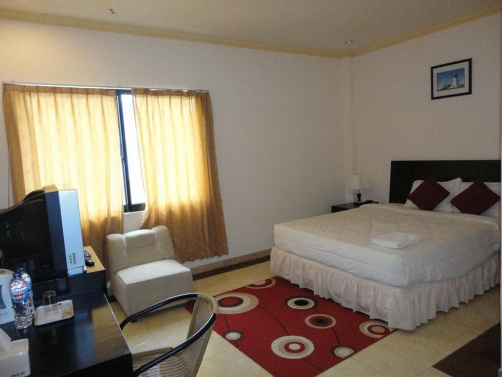 Grand Duta Hotel Palu Værelse billede